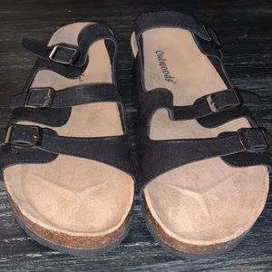 Black sandals, reminiscent of Birks